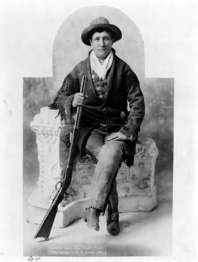 Martha Canary Calamity Jane_ full-length portrait, seated with rifle as General Crook's scout 1895 LOC